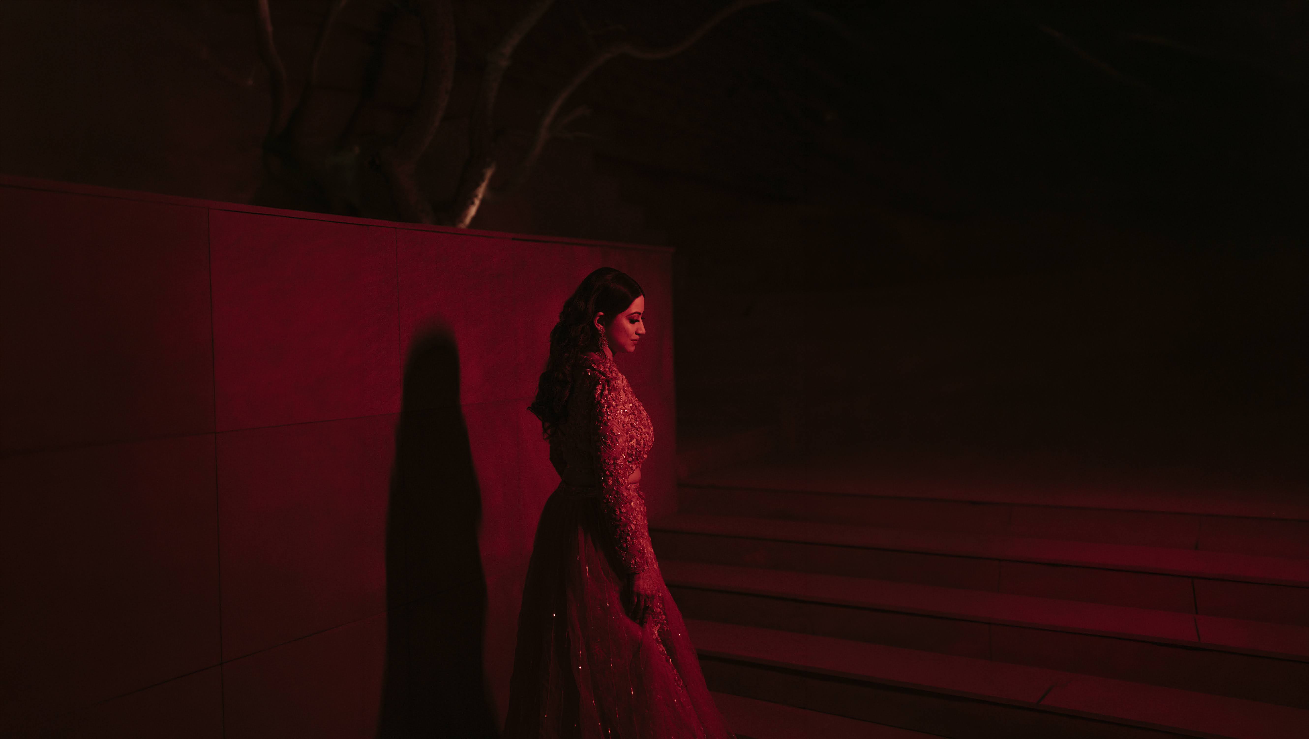 Bride on the stairs in a red lehenga