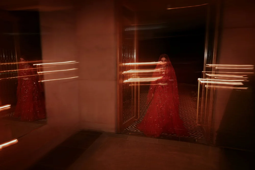 Bride in red at a wedding reception