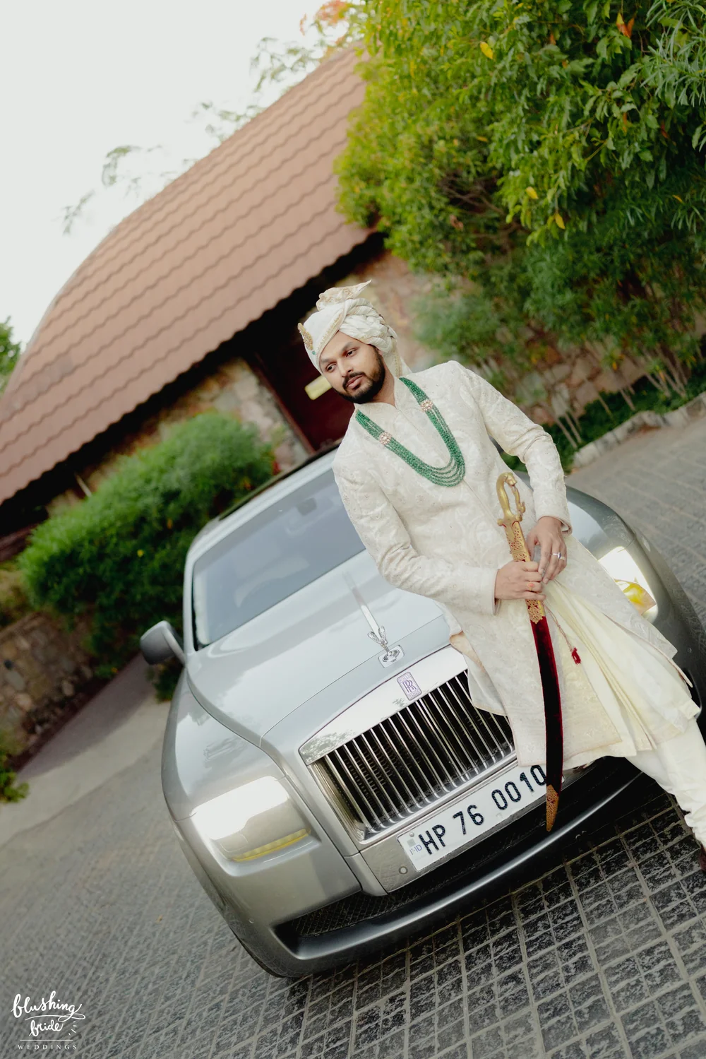 Groom with a vintage car